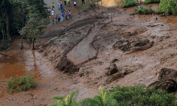 Residents are seen in an area next to a dam owned by Brazilian miner Vale SA that burst, in Brumadinho, Brazil January 25, 2019. REUTERS/Washington Alves